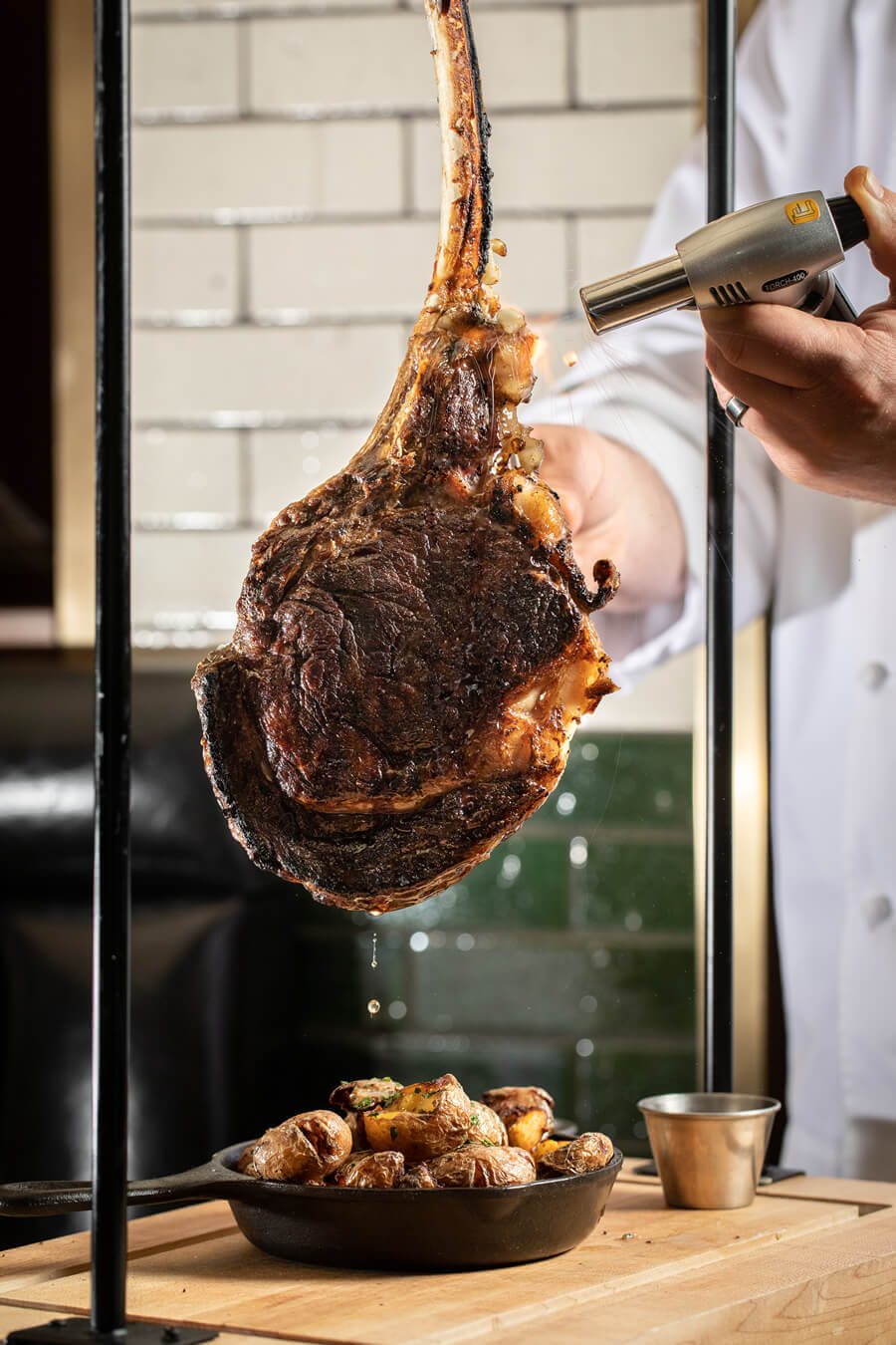 Swinging Tomahawk steak served tableside