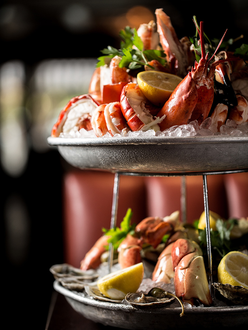 Signature seafood tower with crab, lobster, shrimp and oysters