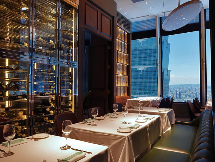 Bar counter and back-bar shelving at a Smith & Wollensky venue, shown as a placeholder image